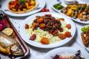 side-view-sour-pilaf-with-lamb-stew-chesntnuts-dried-fruits-plate